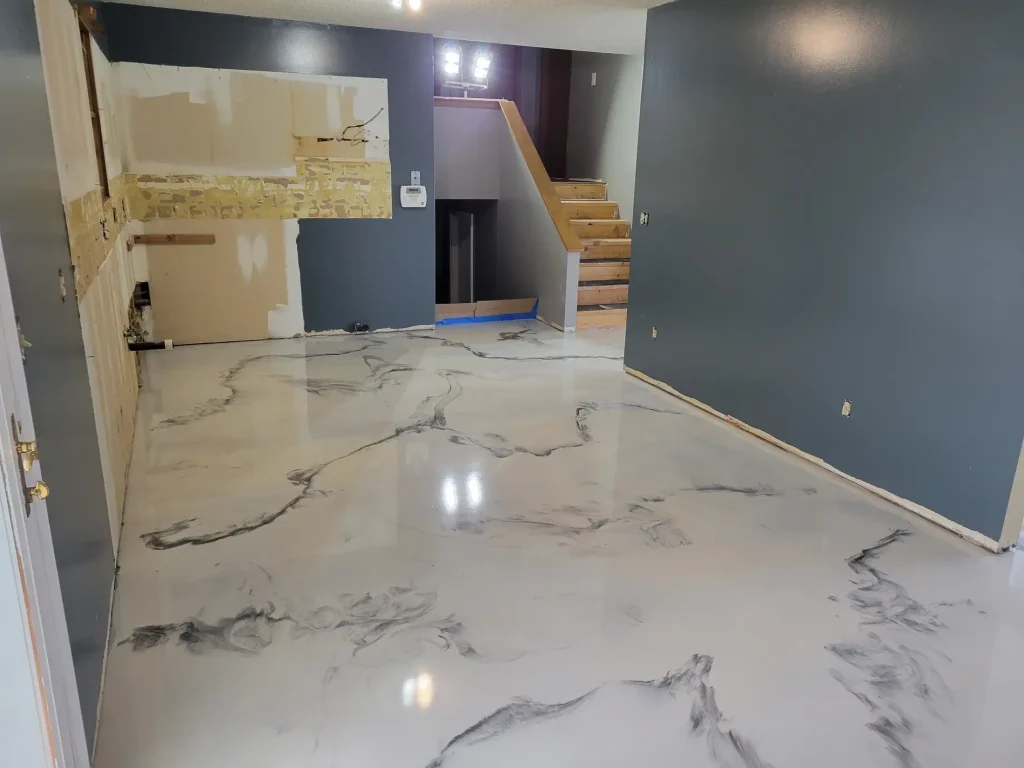 A house with a marble floor that is being painted.