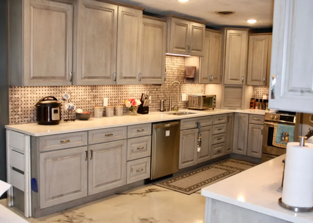A kitchen with gray cabinets and counter tops.