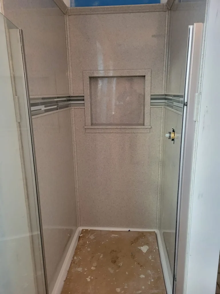 A shower is being installed in a bathroom.