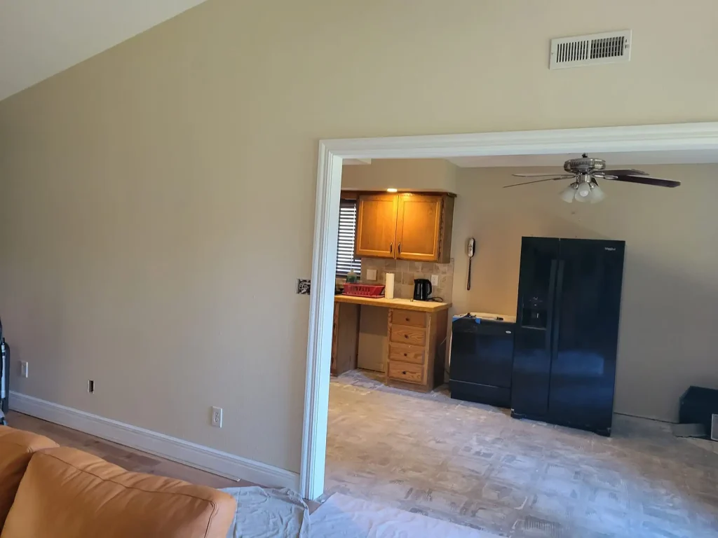 A living room with a couch and a television.