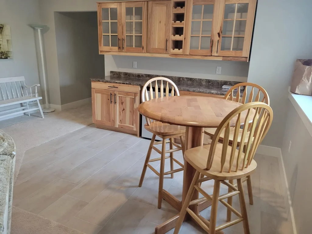 A small kitchen with a table and chairs.